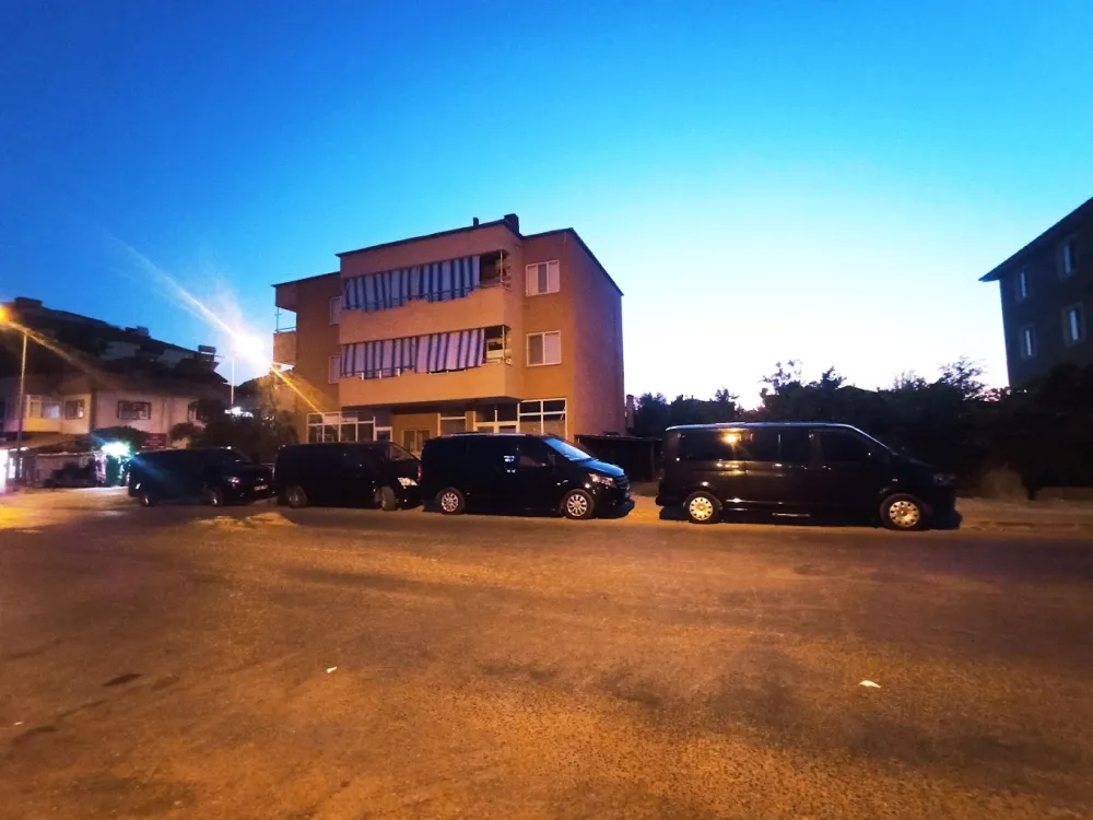  VIP transfer vehicle fleet parked on the streets of Izmir at sunset - group transportation and urban transportation sol